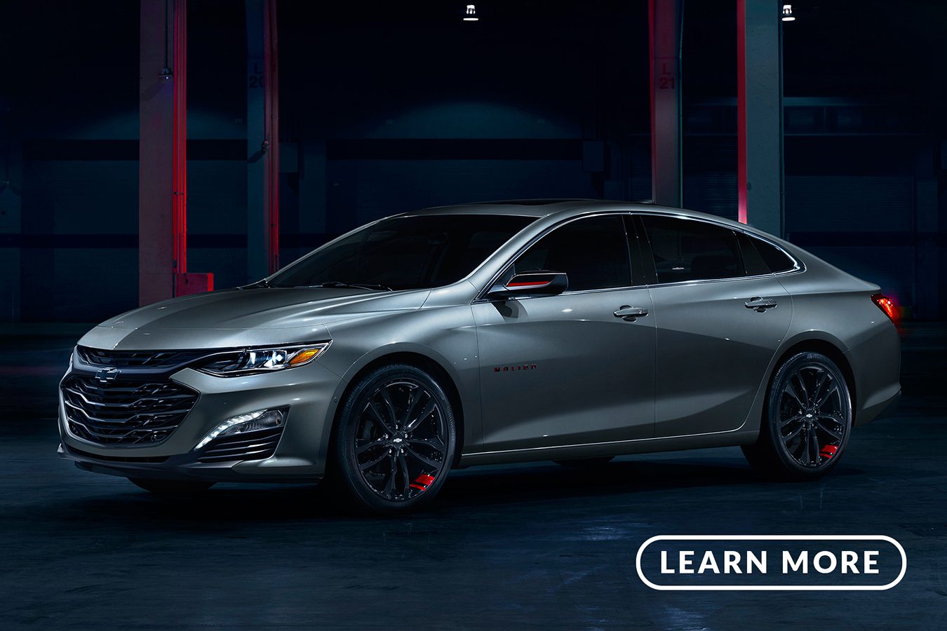 The 2019 chevrolet malibu is shown in a dark garage.