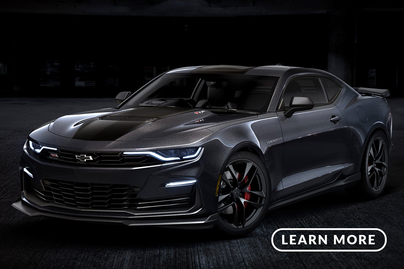 The 2019 chevrolet camaro is shown in a dark room.