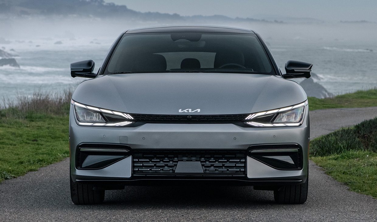 The front end of a 2020 lexus c-suv on a road near the ocean.
