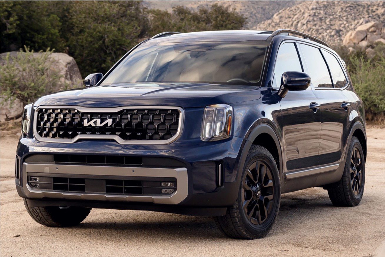 The 2020 kia telluride is parked on a dirt road.