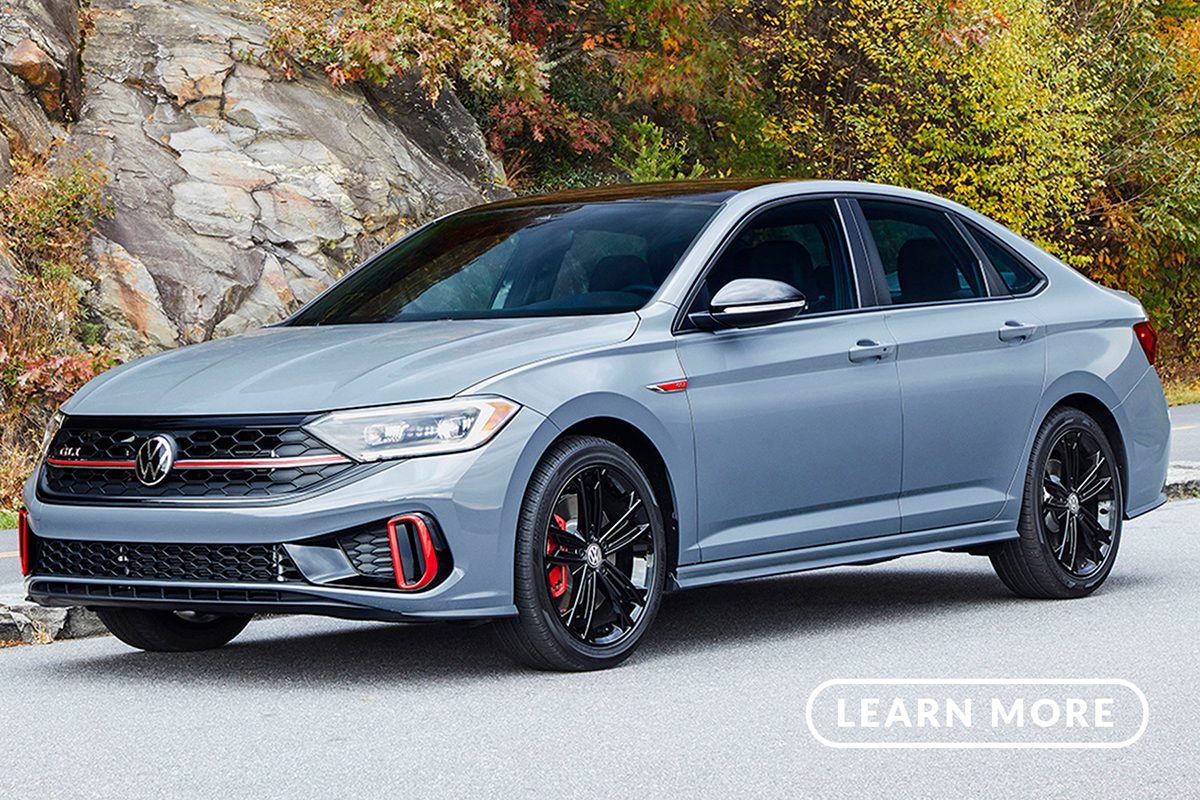 The 2019 volkswagen jetta parked in front of a mountain.