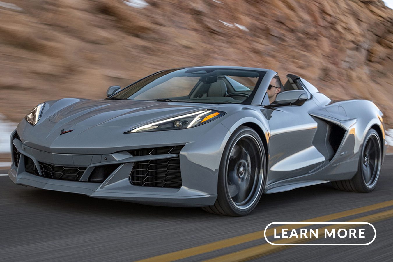 The 2019 chevrolet corvette stingray driving down a mountain road.